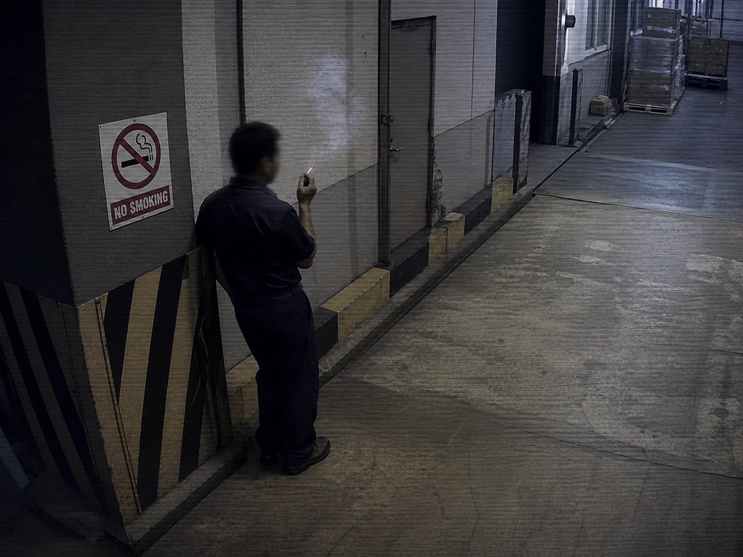 Cigarette ember in a dim restricted zone